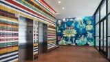 Colored tile on elevator core derived from flags of Latin American countries, mural painted by Aurelio del Muro and Marta Blair