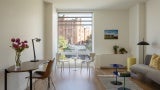 Studio apartment with window facing historic Armory.
