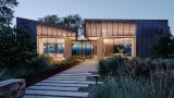 Dusk glow of the interiors permeating out of the building.