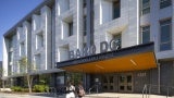 The transformed façade features color and texture variances, chamfered windows that allow for more natural daylight, and a high-performance building envelope.