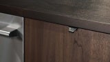 Closeup of recycled leather drawer pulls in The Professional Kitchen