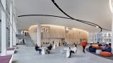 The building is organized into “neighborhoods” connected to an open and expansive commons for collaborative study and meeting space.