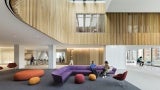The skylit 6th floor lobby serves as a student social space, providing access to residential living and a café.