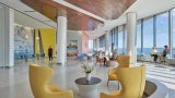As guests enter the dining commons, large mural photographs of Native American life mark individual seating areas throughout the space.