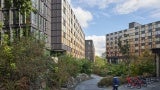 Situated on a natural plateau along a dramatically sloping site, the neighborhood prioritizes green space by reducing impacts on the landscape and maximizing solar orientation where possible. A mid-slope path made a challenging topography readily accessible to all.