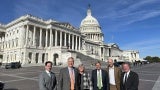 people standing in front of the us capitol