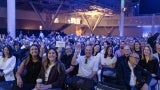 An enthusiastic audience attends the Day 1 general session.