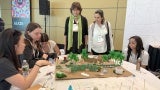High schoolers present their design to architects.