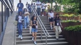 High schoolers visiting the site of their design challenge in Seaport Square.