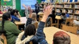 Children raise their hands