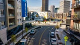 street view facing museum of play with multifamily residences on either side