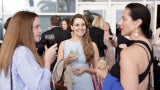 three women chatting hilton bayfront san diego aia26 opening night party