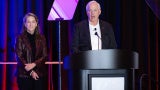 anne marie duvall decker roy decker standing against curtain backdrop architalk