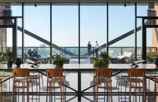 800 Fulton Market Interior space with large wall of windows overlooking the city