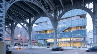 Exterior of Columbia Business School from ground-level underpass