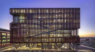 Exterior of Health Sciences Innovation Building at sunset