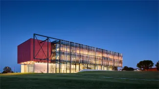 Exterior of Southeast Community College Academic Excellence Center at dusk.