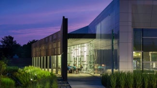 A building with large glass windows at night