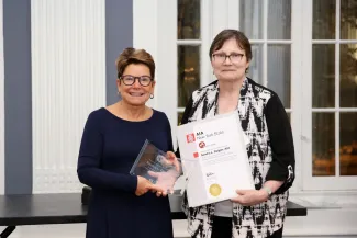 Georgi Ann Bailey receiving the Nelson Aldrich Rockefeller award