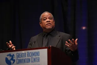 Man speaking at a podium