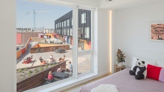 The Block interior corridors, the building takes cues from philadelphia’s rowhouse fabric, relying on an elevated, landscaped deck as primary access for upper level walk-up units