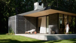 The concrete terrace of The Rambler wraps around the main living pavilion creating a strong connection to the exterior landscape and providing a welcoming corner for friends and family to gather.