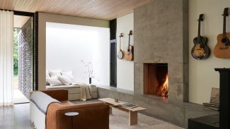 The Rambler's twenty-five-foot-long concrete hearth and site-built fireplace create a warm center to the home where music is written, taught, and performed with the community.
