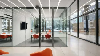 Meeting pod with bright chairs inside of Martin Luther King Jr. Memorial Library 