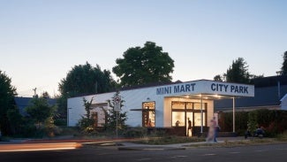 Exterior of Mini Mart City Park at sunset