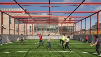 Kids playing on rooftop soccer field at Seattle Academy of Arts and Sciences Middle School 