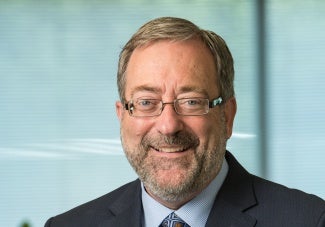 Headshot of man in glasses with beard