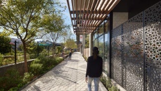 The multi functional pedestrian paseo connects streets, serves community spaces, infiltrates stormwater and provides pollinator habitat.