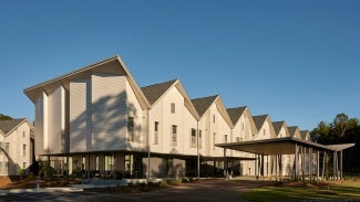 Street view of connected townhouses.