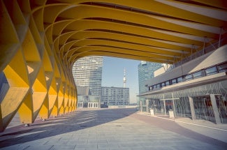 The Austria Center Vienna (ACV) - here the entrance - is Austria's largest convention center and is also one of Europe's most modern. It is used for conferences, exhibitions, corporate events and concerts. Skyscrapers in the background of the Danube and Danube tower can be seen.