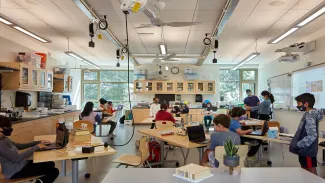 Typical classroom with flexible overhead power supply, ceiling fans for increased ventilation, and windows that provide ample daylight and views