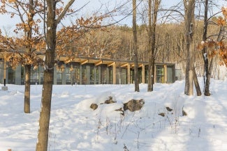 Snowy day at the building, sited near the marshy wetland of Westwood Lake, captures roof rainwater to minimize impact on the watershed.