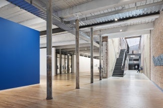 Building interior with exposed brick and ceiling. 