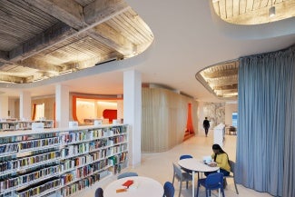 Library interior showing exposed ceiling and other design elements