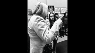 A seventh-grade student speaks with Kelli Glasgow, AIA, a board trustee of AIA Newark & Suburban Architects and a member of the K-12 Committee