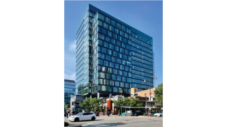 167 North Green Street rises to the sky amidst the active pedestrian-friendly Randolph Street Restaurant Row in the bustling Fulton Market area.