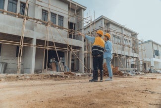 architects work on a housing project site