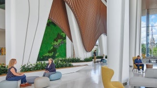 As guests enter the dining commons, large mural photographs of Native American life mark individual seating areas throughout the space.