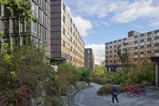 Situated on a natural plateau along a dramatically sloping site, the neighborhood prioritizes green space by reducing impacts on the landscape and maximizing solar orientation where possible. A mid-slope path made a challenging topography readily accessible to all.