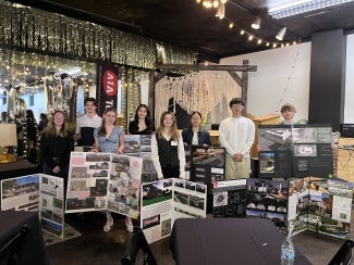 Students displaying their design creations at AIA Toledo's HS Design Competition.
