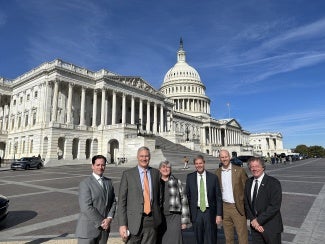 people standing in front of the us capitol