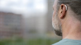 Hearing device in a man's ear
