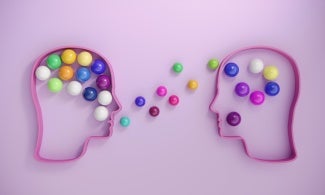purple background two head outlines containing marbles showing marbles being exchanged via speech