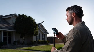A laser distance meter in use outdoors