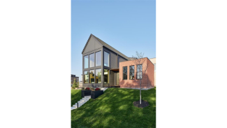 Exterior of the home, showing its expansive windows