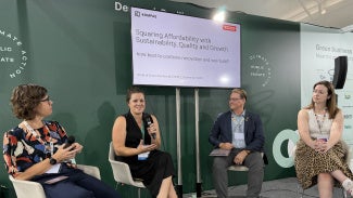 From left to right: Julie Kjestrup; Victoria Burrows of KOMPAS VC; Illya Azaroff, FAIA; and Elinor Huggett of Foster + Partners speaking at the Denmark Pavilion at COP30. 